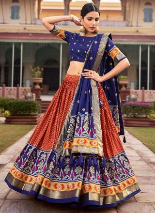 Orange Tussar Silk Traditional Wear Foil Printed Lehenga Choli